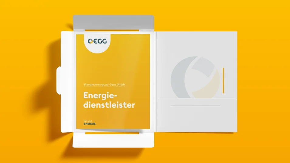Unternehmensmappe mit Geschäftsbericht der Energieversorgung Gera im gelben Corporate Design.