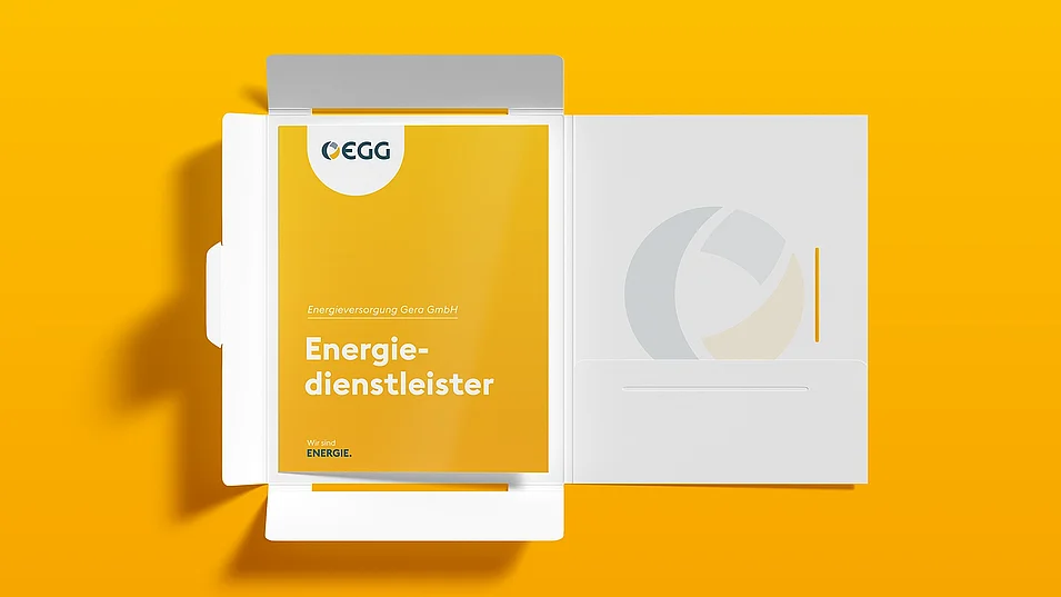 Unternehmensmappe mit Geschäftsbericht der Energieversorgung Gera im gelben Corporate Design.