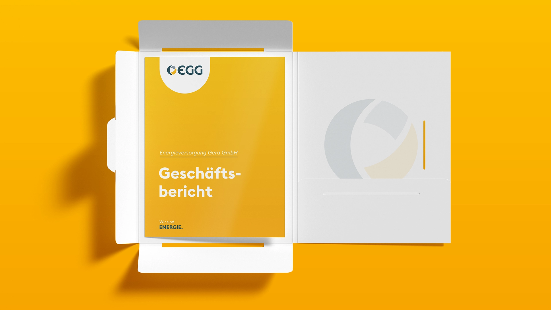 Unternehmensmappe mit Geschäftsbericht der Energieversorgung Gera im gelben Corporate Design.